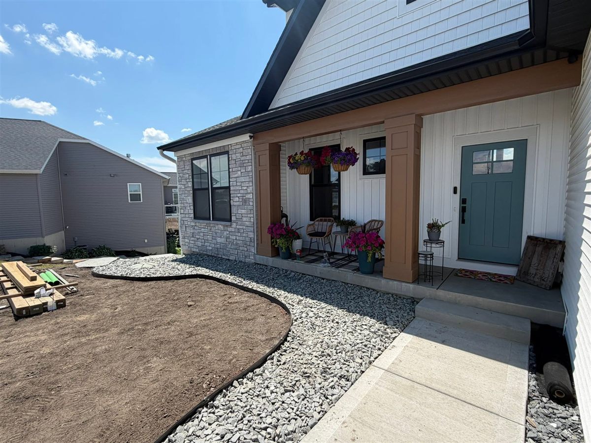 After: front yard with a curved gravel border