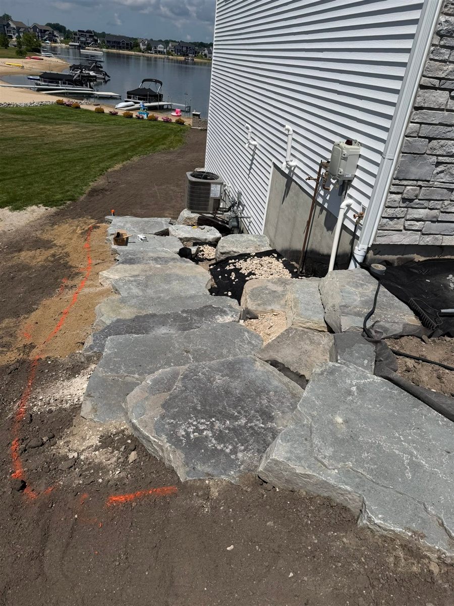 Before: large stones set out along the slope