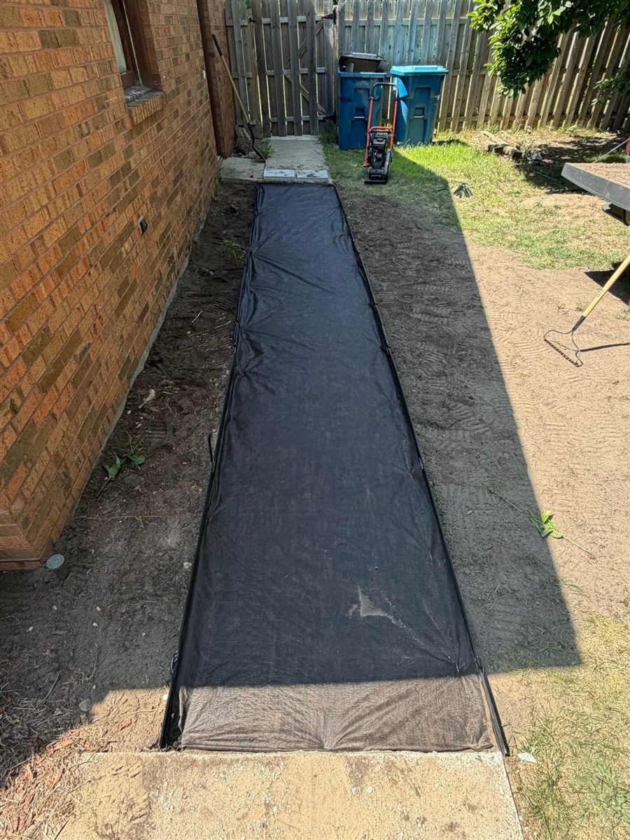 Before: prepared base with landscape fabric